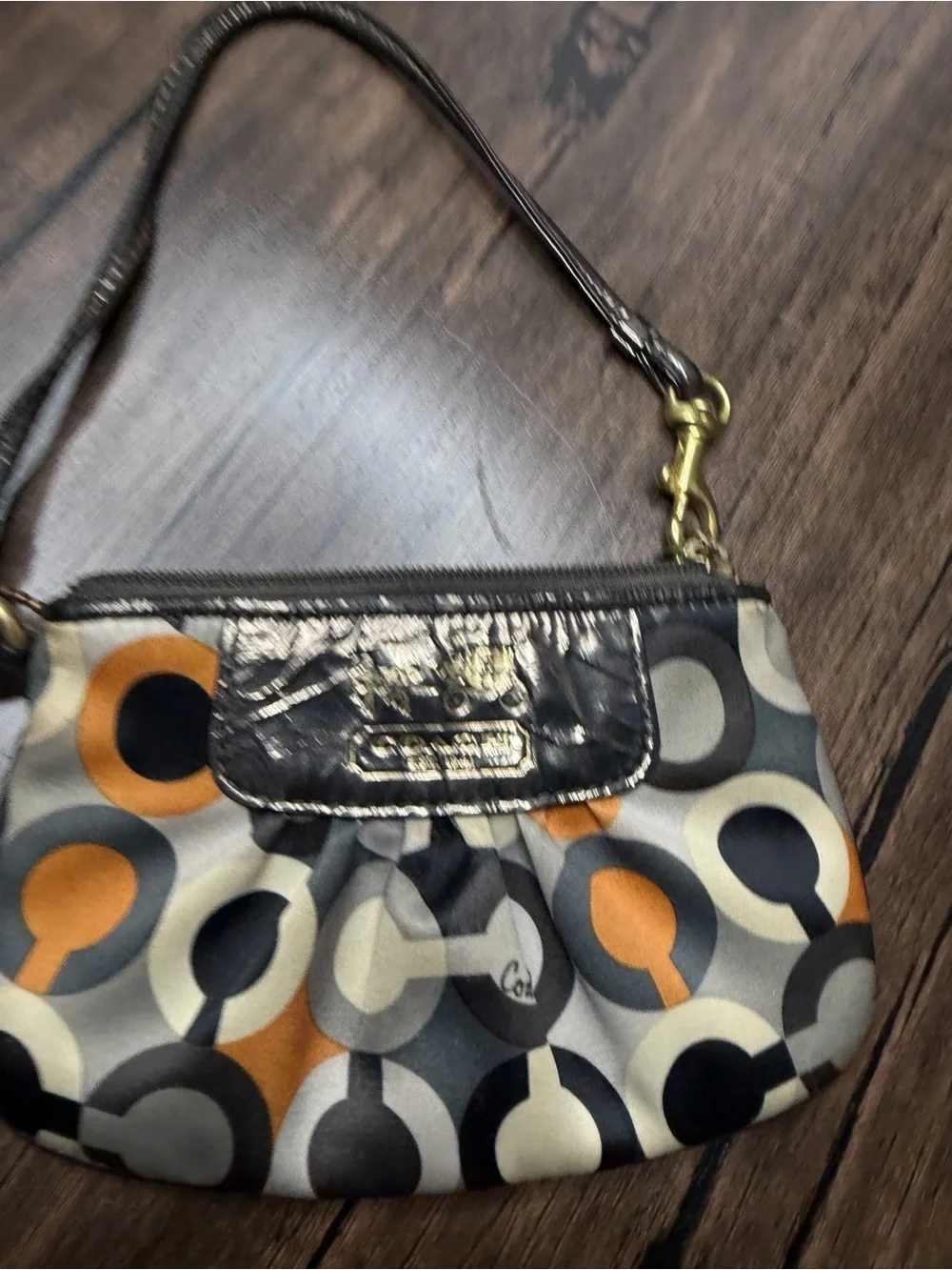 Coach Madison Graphic Op Art sateen Wristlet in Brown and Orange Accents